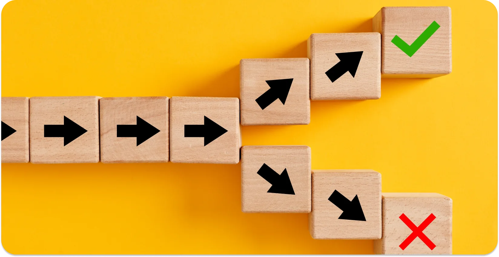 Wooden blocks with arrows, representing decision-making in dictation software.