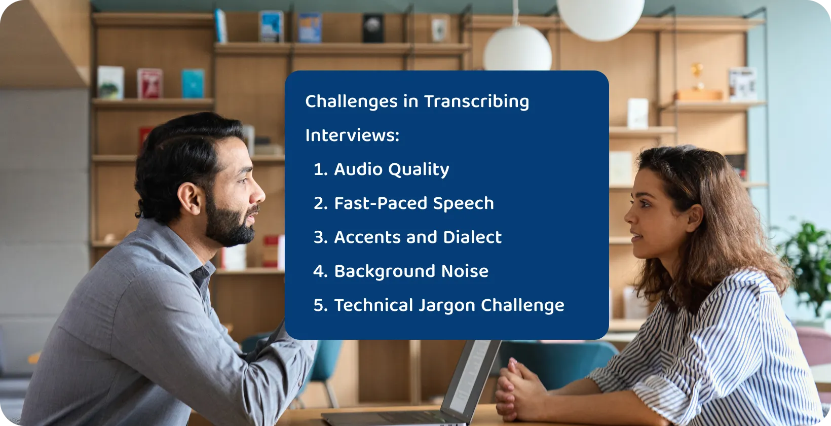 Young two academics in a deep interview, likely consulting on dissertation topics in a well-lit office.